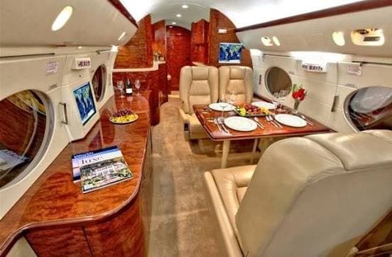 Gulfstream IV cabin with a set dining table in the archive article