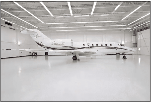 Citation X parked inside a hangar