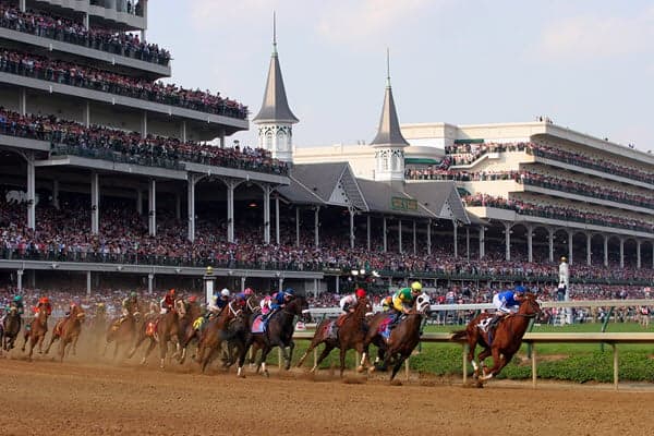 Horse race in front of the Kentucky Derby grandstand